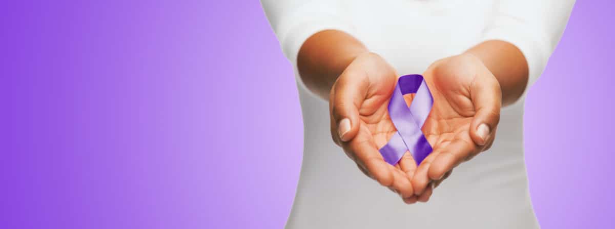 A woman holds a purple Alzheimer's ribbon in outstretched hands